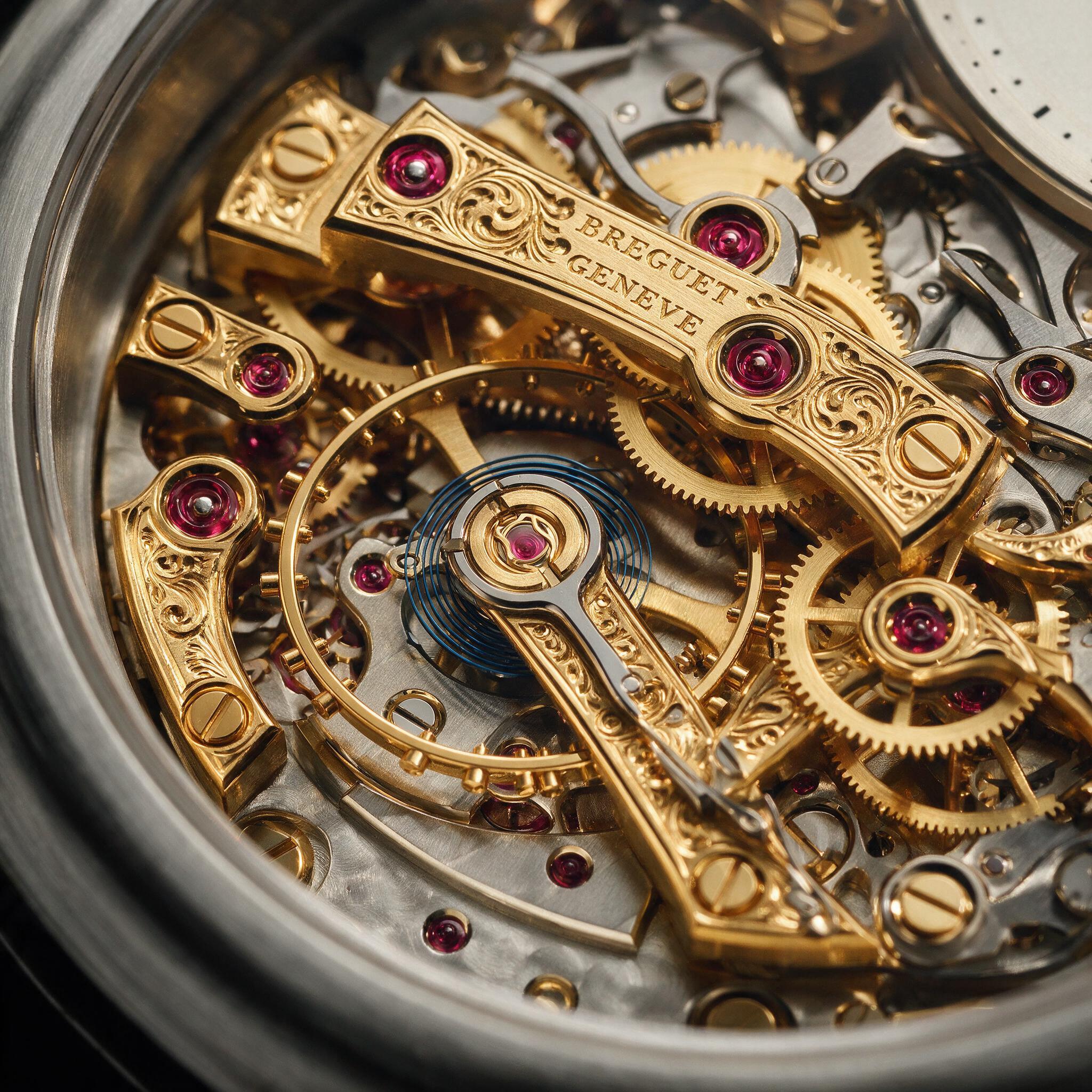 An ultra-detailed 2K macro of a mechanical watch movement with gold engraved bridges, ruby jewels, and a legible engraving